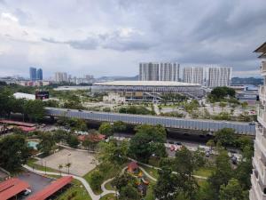 an aerial view of a city with a train at Event Hubs - Axiata Arena, Stadium Bukit Jalil in Kuala Lumpur