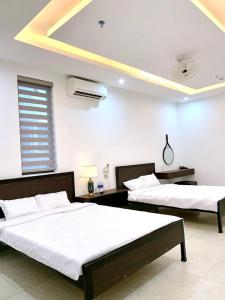 Voodi või voodid majutusasutuse Nhà nghỉ Sunday A Lưới toas