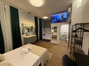 a room with two beds and a flat screen tv at Ventura Luxury in Alicante