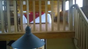 a stair case with a lamp and a stair railing at A Cabana de Cao in Loiba