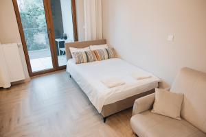 Postel nebo postele na pokoji v ubytování Rezydencja Ogród Saski Lublin