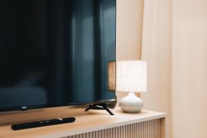 TV a/nebo společenská místnost v ubytování Rezydencja Ogród Saski Lublin