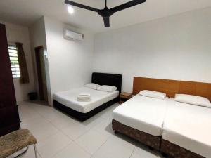 En eller flere senge i et værelse på Guesthouse Fasa 2B