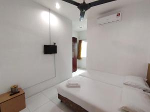 En eller flere senge i et værelse på Guesthouse Fasa 2B