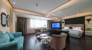 TV a/nebo společenská místnost v ubytování Xana Hotelle·Shenyang North Railway Station Square