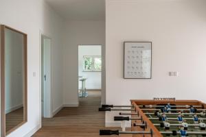 a chapel with wooden pews and a calendar on the wall at Bela Vista - Countryside home in Gradil