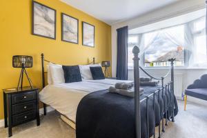 a bedroom with a bed with teddy bears on it at HIGHBANK HOUSE - Three Bed Stylish House in North Yorkshire in Harrogate