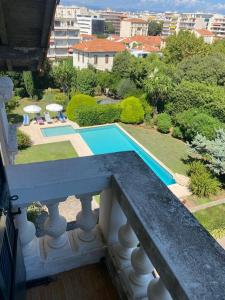 a balcony of a house with a swimming pool at Magnifique propriété - Piscine - Mer in Antibes