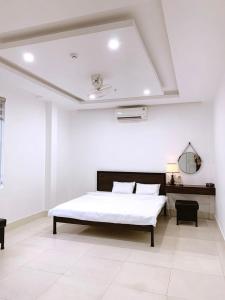 Voodi või voodid majutusasutuse Nhà nghỉ Sunday A Lưới toas +3 fotot