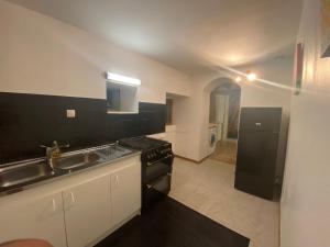 Kuchyň nebo kuchyňský kout v ubytování L'Oret'Home + 12 fotografií