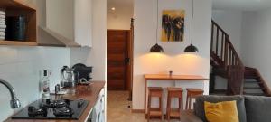 a kitchen with a stove and a counter top at Casa Augusto Stunning view in Trindade