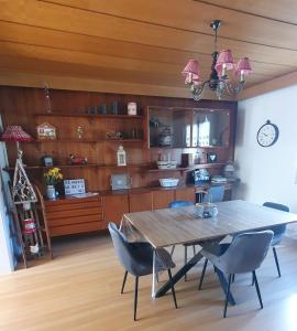 a dining room with a table and chairs at Le Meix du Lac 3 étoiles - 200 m du lac - 50 m navette ski in Gérardmer