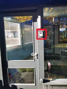 a door with a red mailbox on the side of it at Ferienwohnung Waldbröl in Waldbröl +31 photos