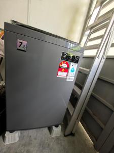 a machine with many stickers on the side of it at Padang Serai Wangi Homestay 402 in Padang Serai