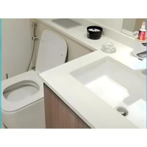 a bathroom with a toilet and a sink at Horizon Tower, Ajman in Ajman 