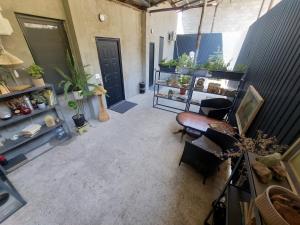 a living room with a room with plants on shelves at Komfort Ilona in Yerevan
