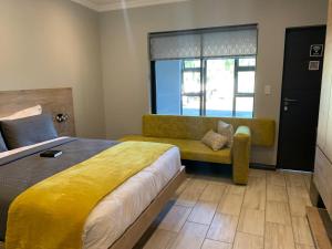 Ένα ή περισσότερα κρεβάτια σε δωμάτιο στο Hephaestus Guesthouse