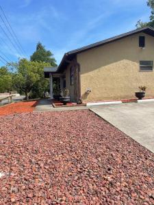 a house with a gravel driveway in front of it at River Side Downtown 3 mins away!! in New Port Richey