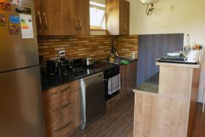 Kuchyň nebo kuchyňský kout v ubytování STOP HOUSE Mestia