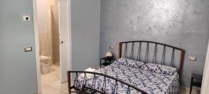 a bedroom with a bed in a room at La Casa di Edo in Montale