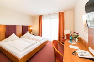 Postel nebo postele na pokoji v ubytování Hotel Restaurant Vater Rhein + 23 fotografií