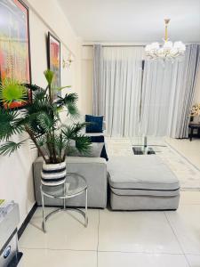 a living room with a couch and a table at Skyhorse condo in Nairobi