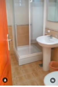 a bathroom with a shower and a sink at Montenegrina in Budva