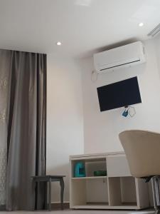 Μια τηλεόραση ή/και κέντρο ψυχαγωγίας στο Luxueux f4 au cœur d Alger +16 φωτογραφίες