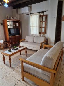 a living room with a couch and a table at John' s House in Omodos in Omodos