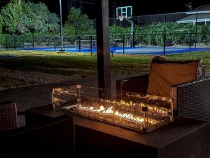 a fire pit on a patio with a basketball court at Vernal Sport-Court Base Camp in Vernal