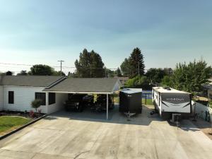 a house with a patio and a rv and a grill at Vernal Sport-Court Base Camp in Vernal