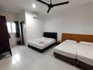 En eller flere senge i et værelse på Guesthouse Fasa 2B