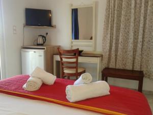 Postel nebo postele na pokoji v ubytování Hotel Petras Beach