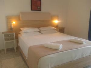 Postel nebo postele na pokoji v ubytování Hotel Petras Beach