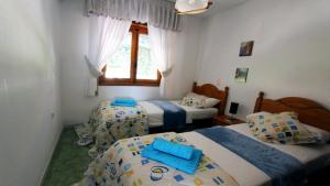 a bedroom with two beds and a window at R-3429 Bungalow La Mata in La Mata