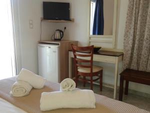 Postel nebo postele na pokoji v ubytování Hotel Petras Beach