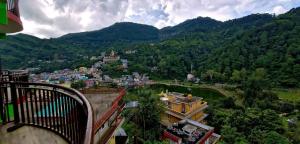 a view of a town in the mountains at Nitin Home Stay in Rewalsar