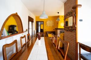 a dining room with a long table and chairs at Tra Emilia e Toscana - Country Retreat & Outdoor in Toano +78 photos