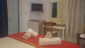 Postel nebo postele na pokoji v ubytování Hotel Petras Beach
