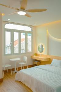 Ένα ή περισσότερα κρεβάτια σε δωμάτιο στο Tom's Homestay 2 +37 φωτογραφίες