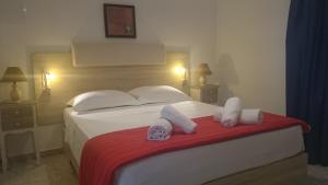 Postel nebo postele na pokoji v ubytování Hotel Petras Beach