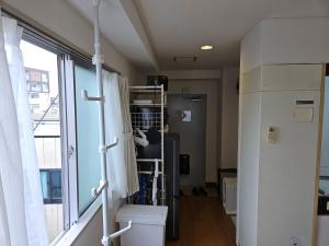 a room with a hospital room with a window at ホテルレスポワール402 in Tokyo +26 photos