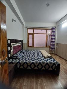 Postel nebo postele na pokoji v ubytování The Nest#9