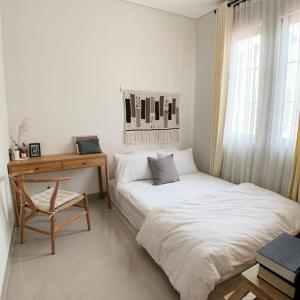 Ένα ή περισσότερα κρεβάτια σε δωμάτιο στο Abbasy Homestay