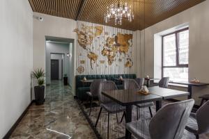 a restaurant with a map of the world on the wall at LITO Hotel in Odesa