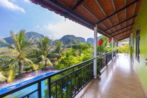 a balcony with a view of the mountains at Ninh Binh Footprint Homestay in Ninh Binh
