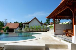 an image of a swimming pool in a house at Ginantary Cottages in Uluwatu