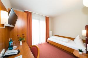 Postel nebo postele na pokoji v ubytování Hotel Restaurant Vater Rhein