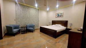 En eller flere senge i et værelse på Peace House II