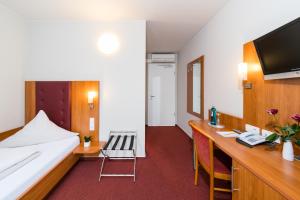 Postel nebo postele na pokoji v ubytování Hotel Restaurant Vater Rhein